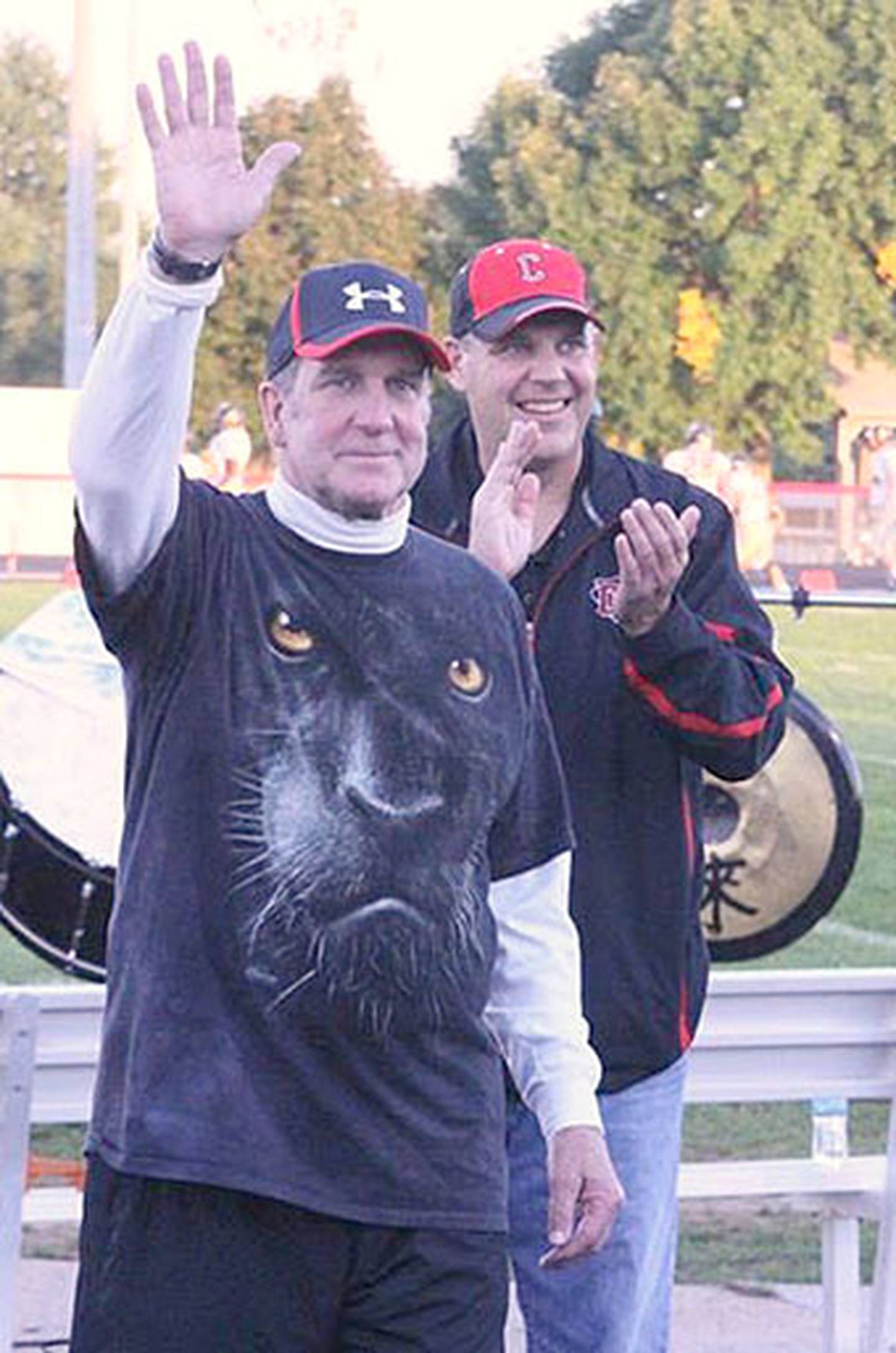 Retired Creston football coach and math teacher Dick Bergstrom is introduced at the home football game in 2015 when he was inducted into the school's Hall of Fame. He is shown with Bill Messerole, CHS principal.