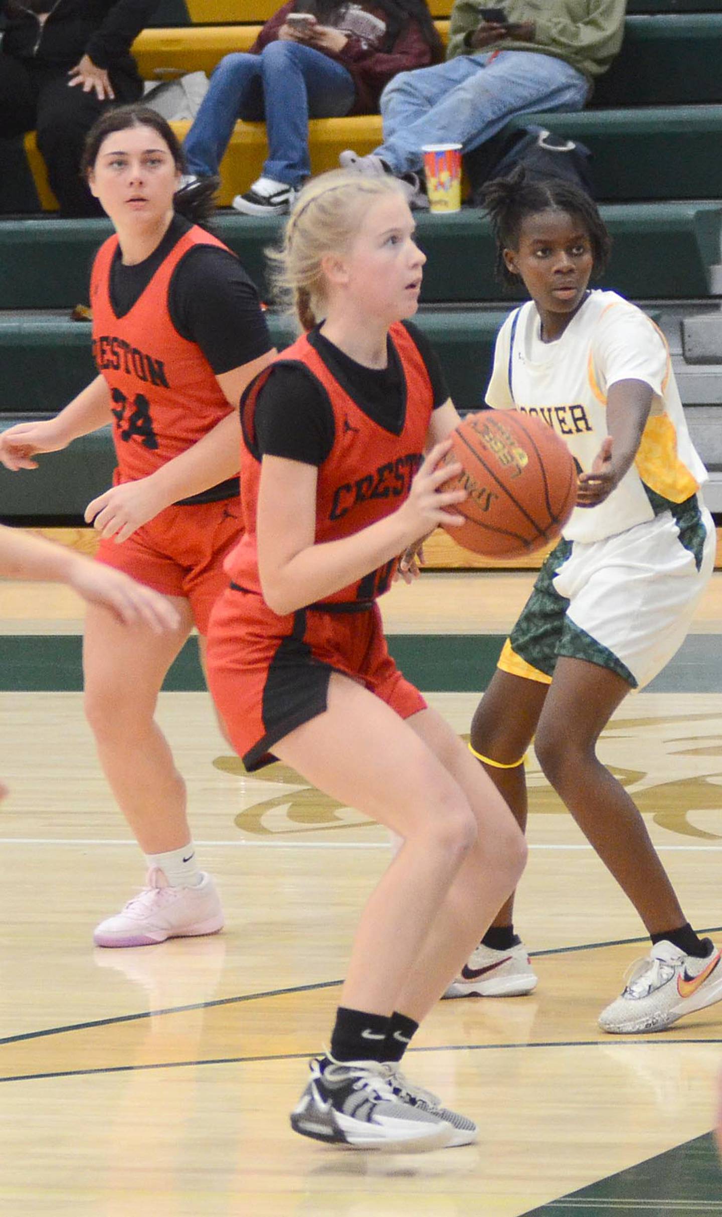 Creston sophomore Reese Strunk pulls up for a shot near the free throw line Friday as teammate Kennedy Strider cuts near the top of the key.