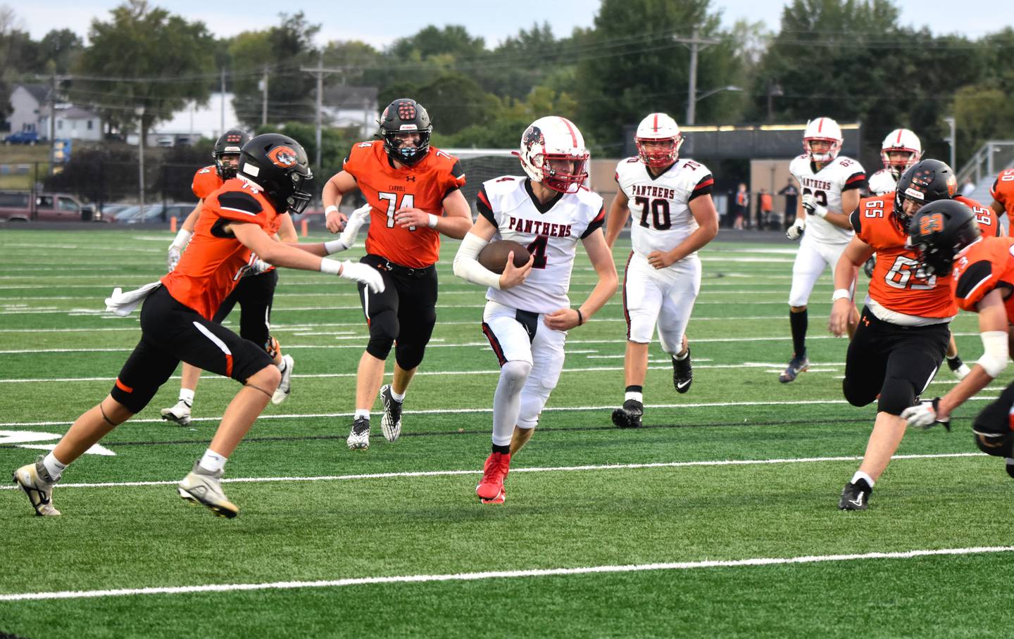Creston senior Cael Turner evades defenders for the first touchdown of the game, a 7-yard quarterback keeper. Turner threw 11-12 for 431 yards and five touchdowns.