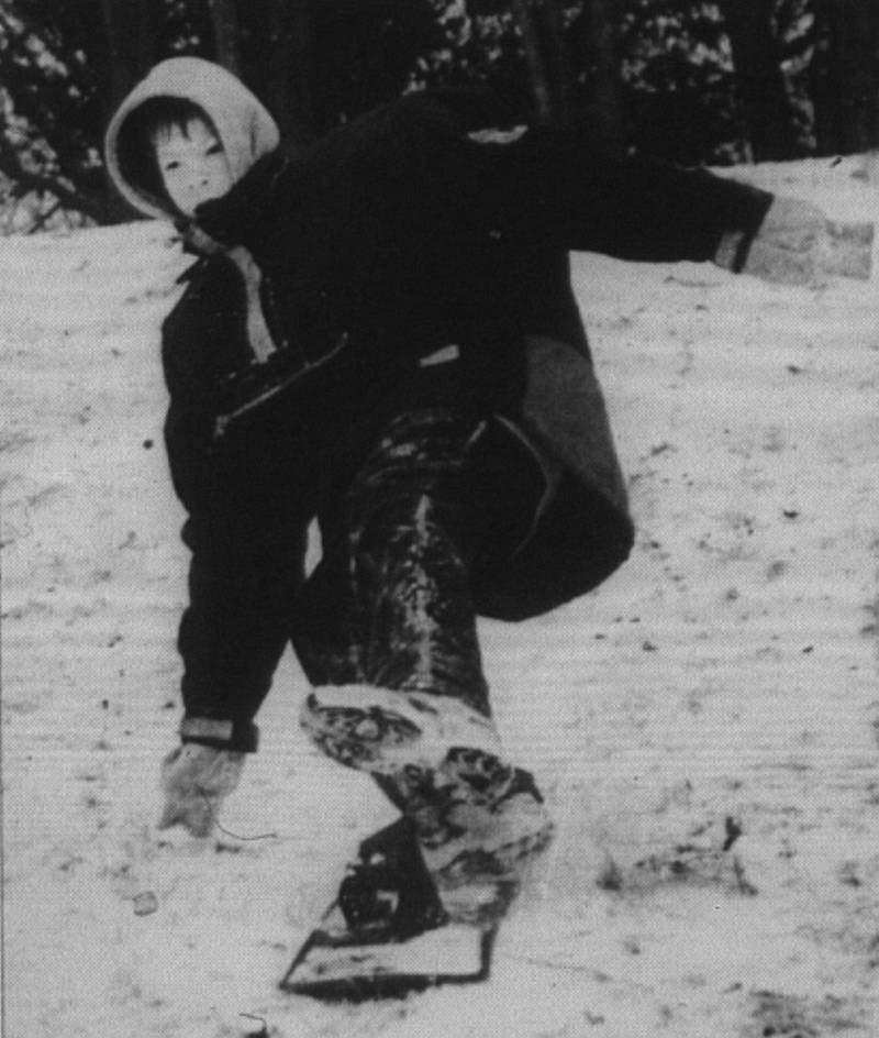 Tim Pingree, 12, adds a little Hokey Pokey to his snow boarding Sunday afternoon at Irving Elementary.
