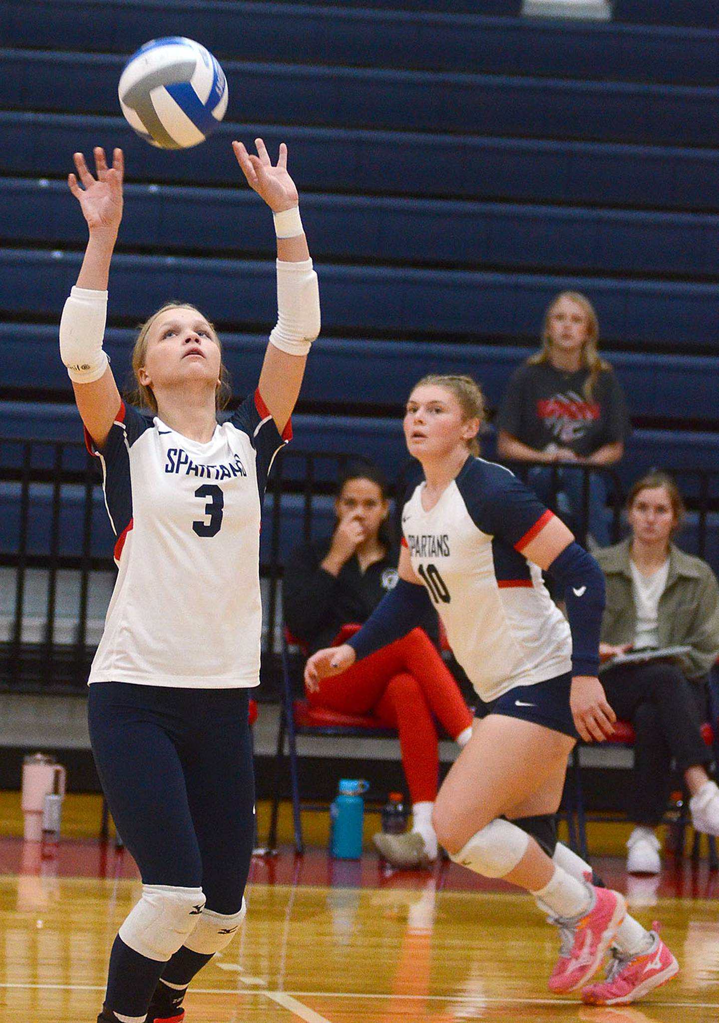 Southwestern freshman Savanna Marriott sets the ball as Maddie Richter (10) gets in position. Marriott had a team-high seven assists.