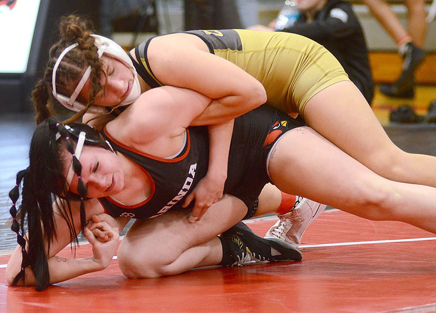 Grace Keeler of Creston controls Randi Welchans of Clarinda in the match determining first place at 135 pounds Friday. Keeler won by fall and reached 100 career pins during the tournament.