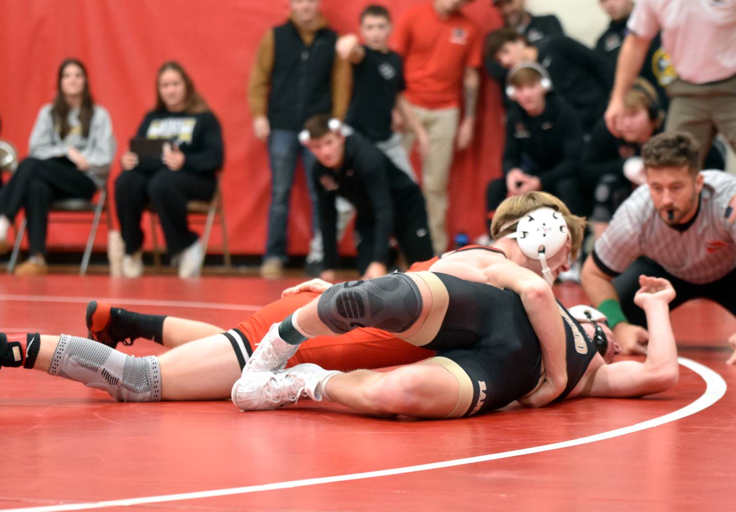 Brodrick Phelps works to pin Glenwood's Ben Christiansen Tuesday at home. Phelps was 2-0 on the night.