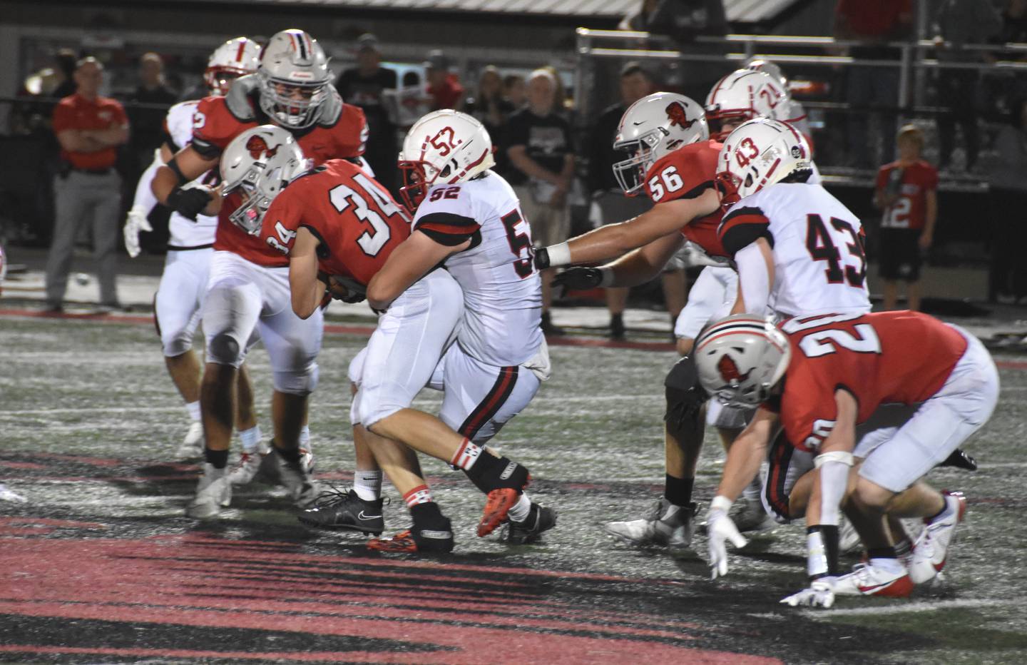 Creston senior Mattias Schultes (No. 52) wraps up Harlan running back Ayden Redmon. Schultes had three solo tackles on the defense that delivered a game-winning stop.