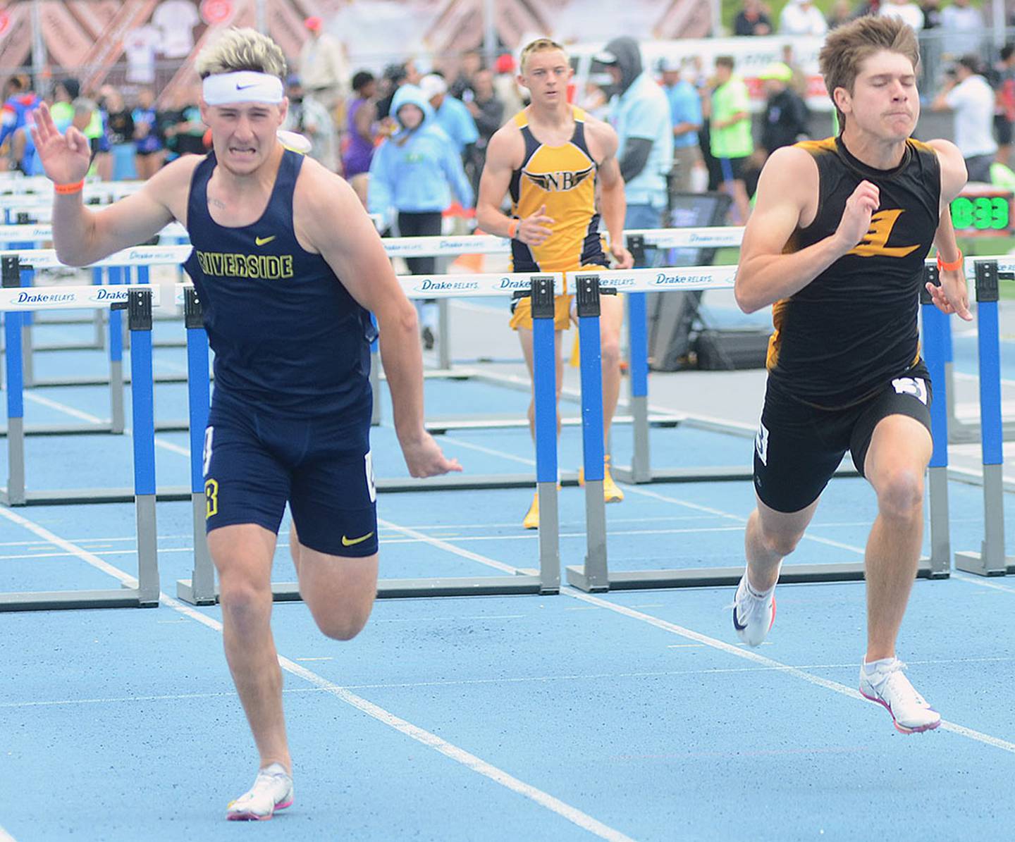 Dawson Evans of Lenox (right) runs alongside heat winner Jaxon Gordon of Riverside in the 110 meter high hurdles preliminaries Friday. Evans placed fifth in Saturday's finals in 14.78.