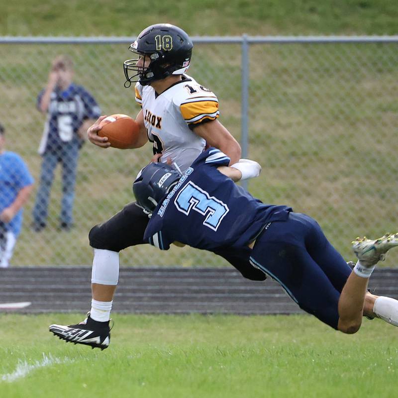 East Union's Austin Lack gets a tackle on Lenox's Jordan-Martin England Friday as the Tigers earn a 54-8 district victory.