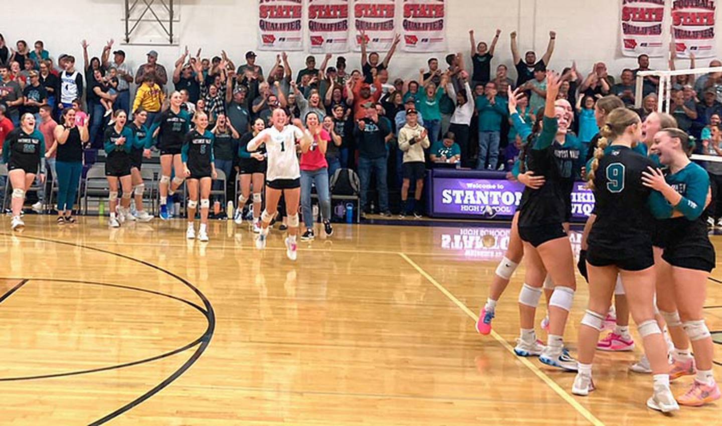 Southwest Valley players celebrate the team's 3-0 regional semifinal victory at Stanton Monday night. The Timberwolves play Janesville Wednesday at North Polk High School for a berth in the state tournament.