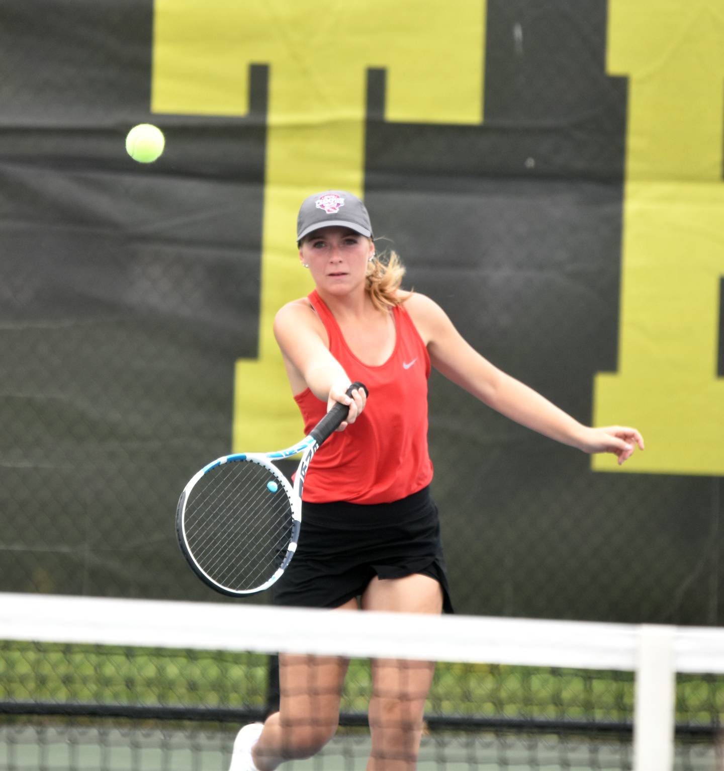 Sasha Wurster hits a ball close to the net. She won her singles and doubles matches against Atlantic.
