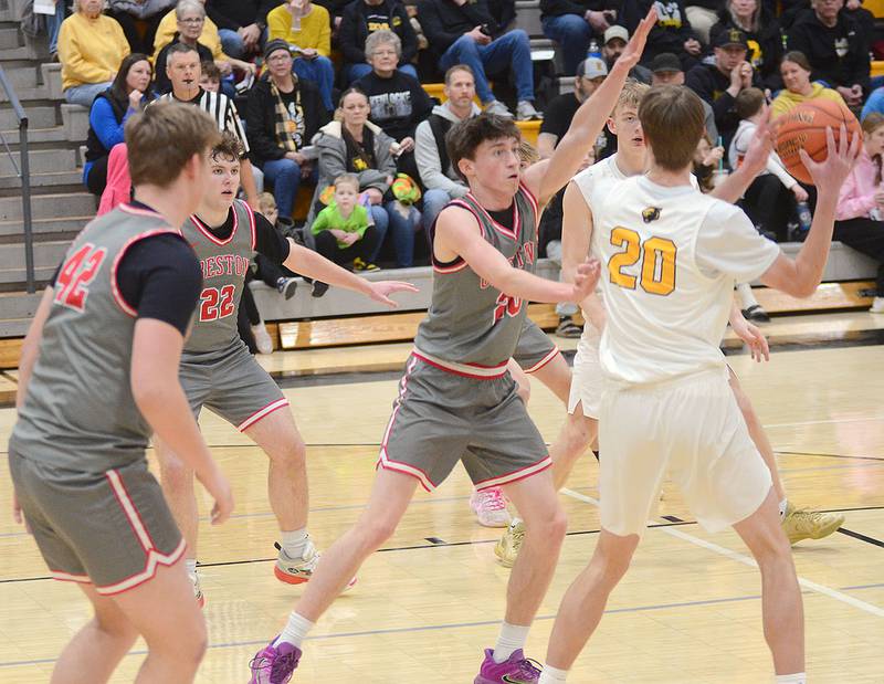 Knoxville's Nolan Smith (20) looks for options against Creston defenders Layne Sand (42), Nathan Carroll (22) and Jaxson Jondle (20).