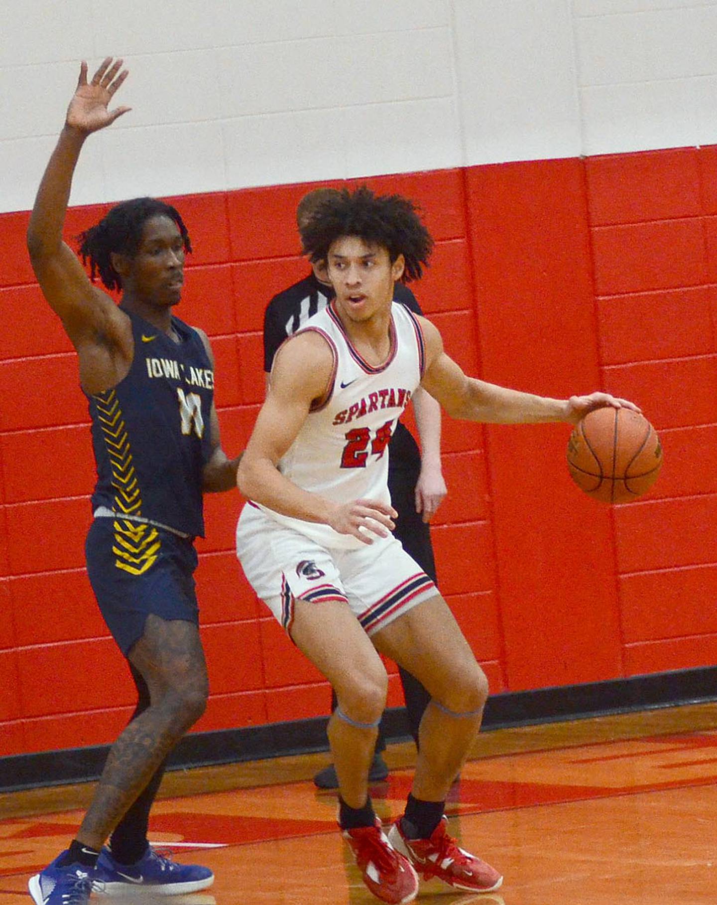 Andrew Scoggins of Southwestern (24) drives toward the lane against Iowa Lakes Saturday. Scoggins scored 17 points in the 60-59 victory.