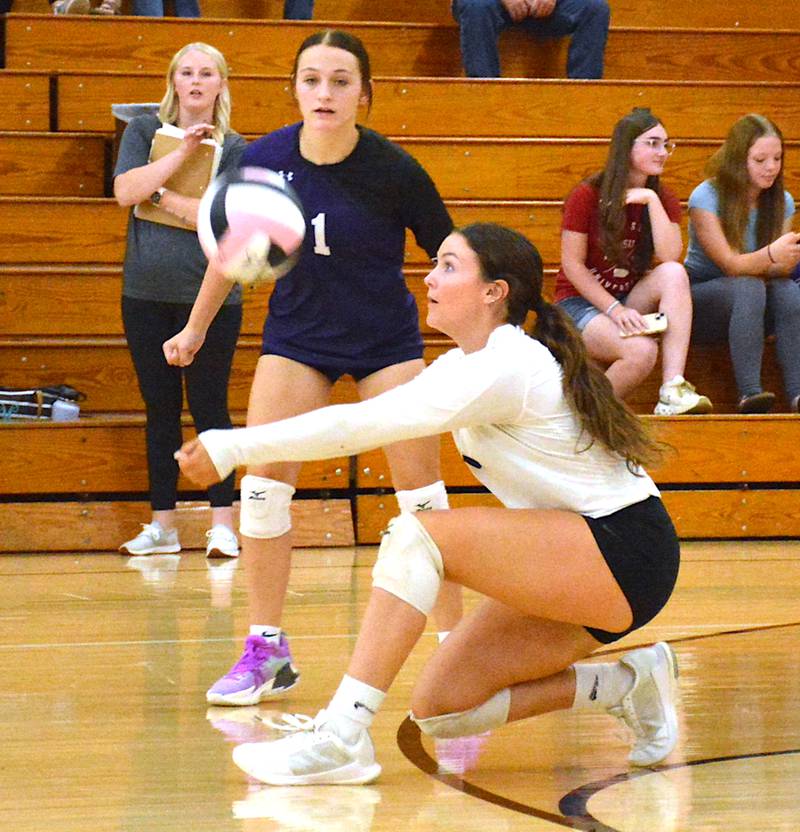 Nodaway Valley senior Liv Laughery digs the ball during a volleyball match at home earlier this season.