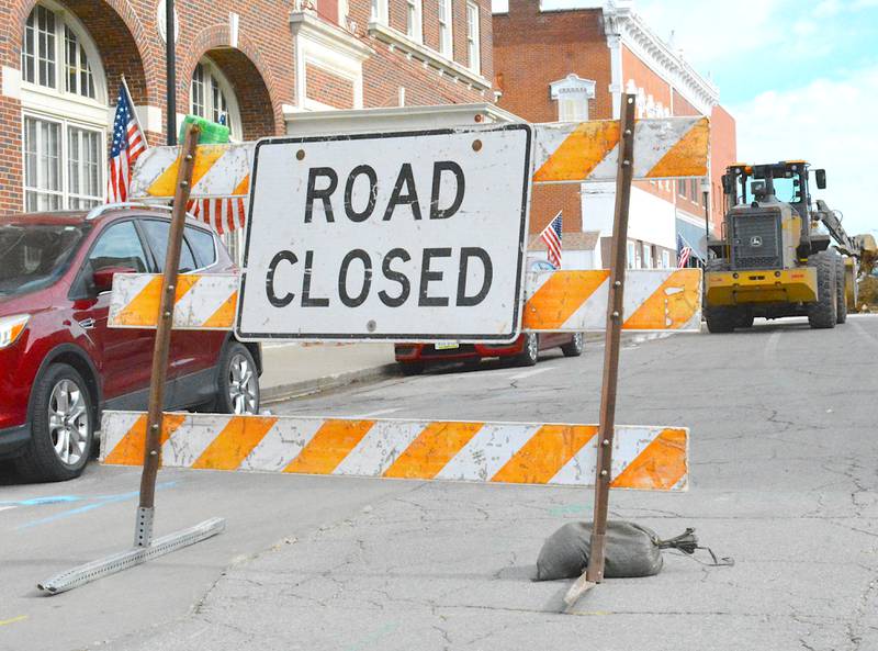 Construction is moving west along Mills Street, reaching past Pine Street.