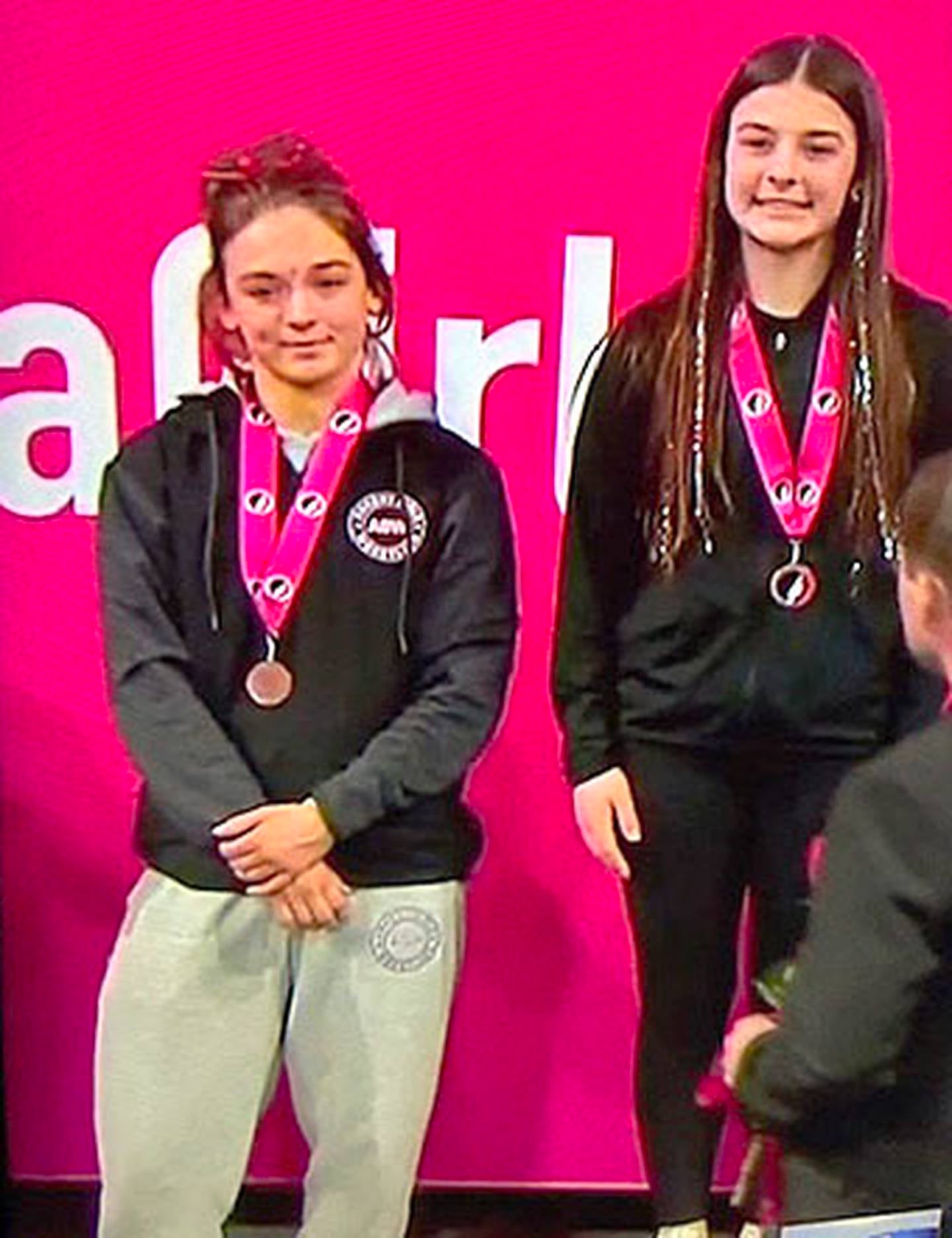 Former Creston wrestler Karlie Kruse of Ankeny (left) placed sixth at 125 pounds in Class 2A.