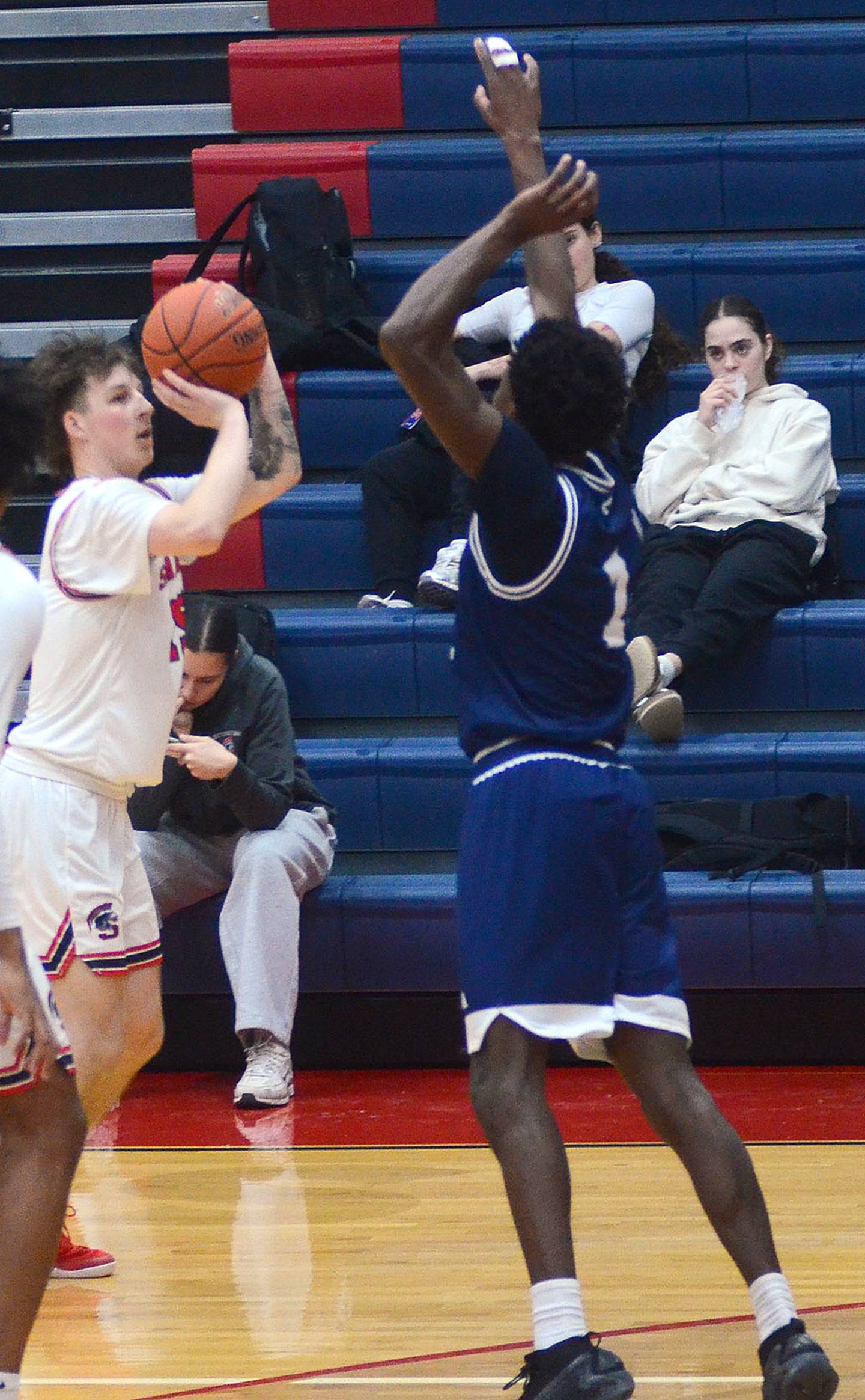 Bayley Lattenstein shoots a 3-pointer against Iowa Central. Lattenstein had seven points, five rebounds and three assists in the game.