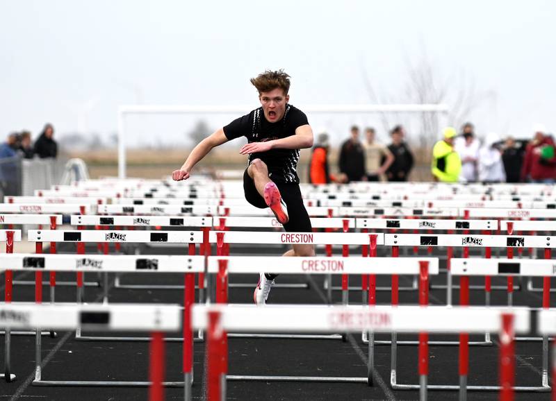 Cason Scarberry anchors the boys shuttle hurdle relay Tuesday during a windy Hawkeye 10 south meet hosted by Creston.