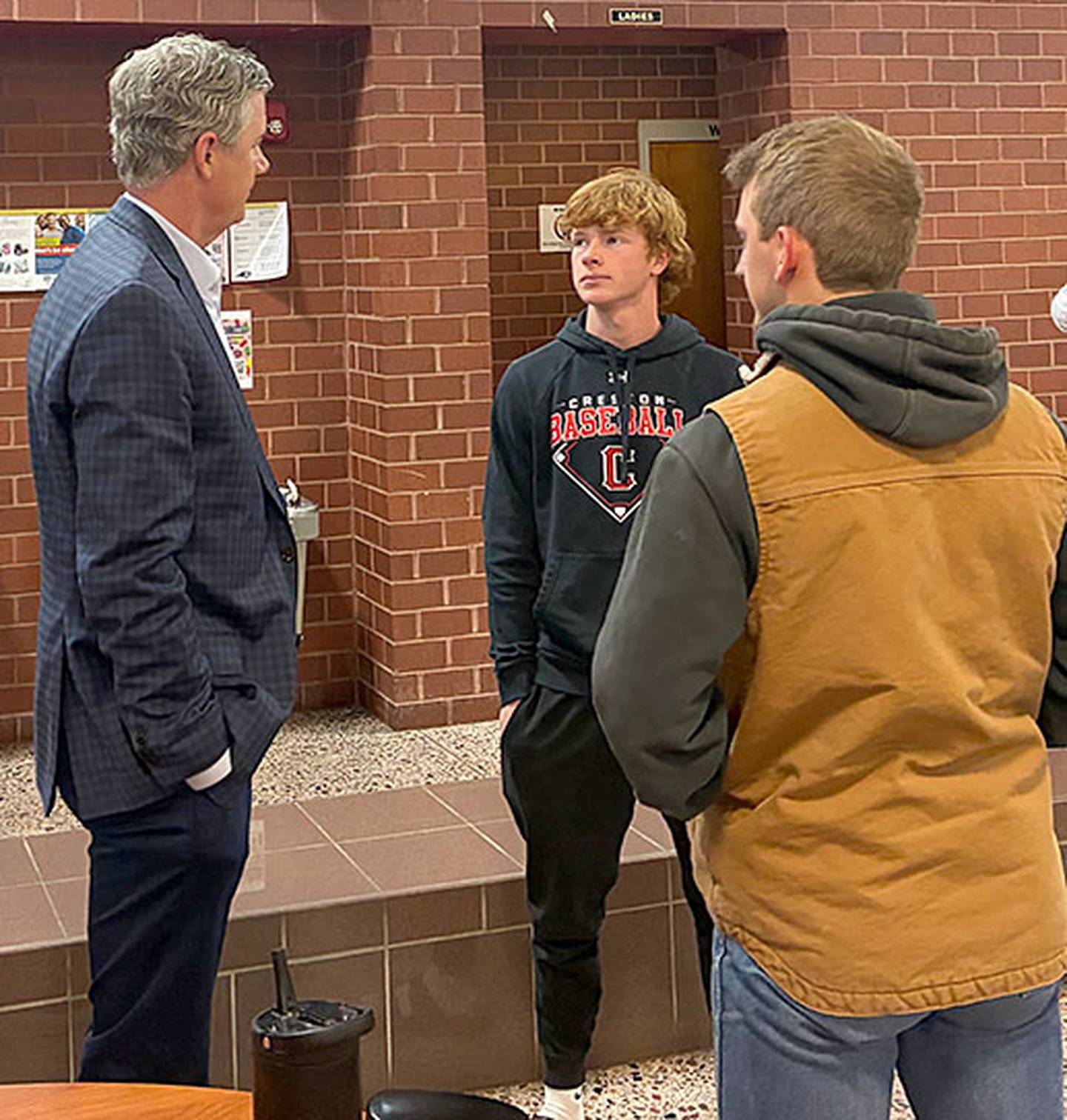Creston Hall of Famer Kyle McCann (left) speaks with current CHS students Tanner Ray (center) and Davin Wallace after Wednesday's leadership class.