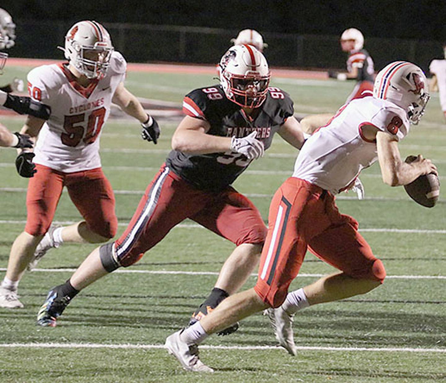 Creston defensive end Max Chapman chases Harlan quarterback Will Arkfeld in Creston's homecoming game Sept. 22. Chapman is the Class 3A leader with 20.5 tackles for loss.