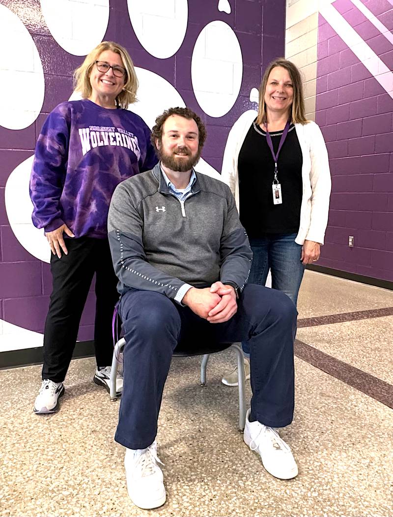 Nodaway Valley first-grade teachers Susan Marnin and Shelly Harris (standing) were elementary principal James Larson's preschool teachers.