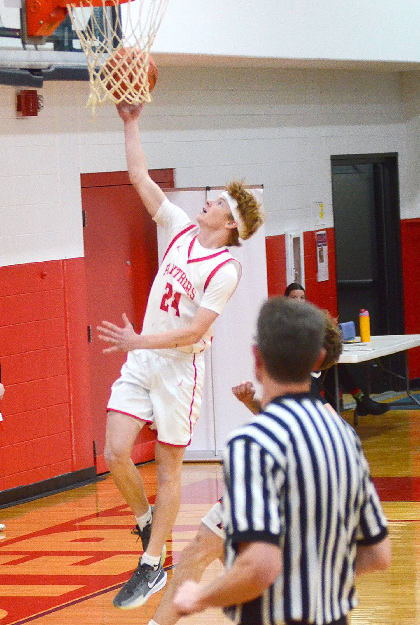Creston's Tanner Ray scores a fast break layup for the Panthers against Madrid Thursday night. Ray's shot at the regulation buzzer forced the first of two overtimes in a 50-50 tie before Madrid was victorious in the second overtime, 64-58. Ray had a team-high 19 points.