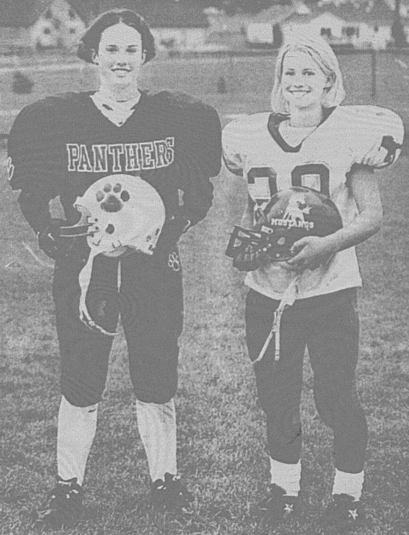 Creston/O-M junior Michelle Clausen and Murray freshman Amanda Keller are serious about playing football.