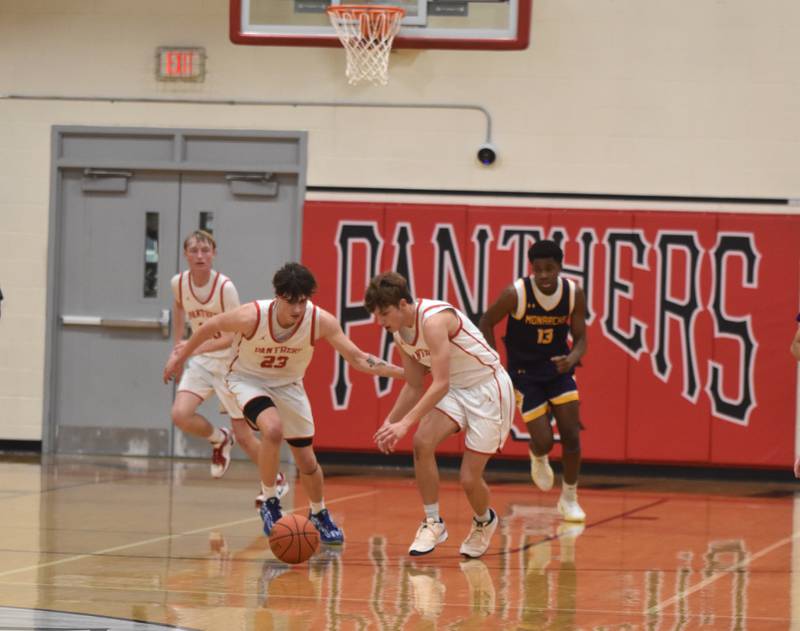 Jake Hoyt, front left, and Cael Barton, go for a loose ball Friday against Denison-Schleswig in what coach Bryce Schafer called the team's best defensive performance this year.