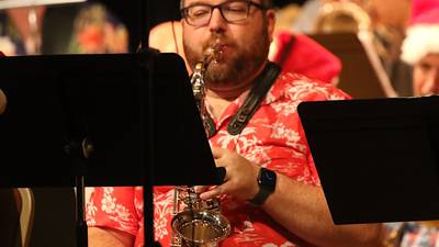 Greenfield sax player helps celebrate Christmas in July