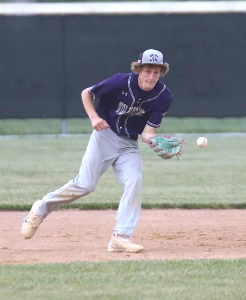 NV/OM senior Paul Berg fields a ball hit into the infield during a baseball game against Southwest Valley.