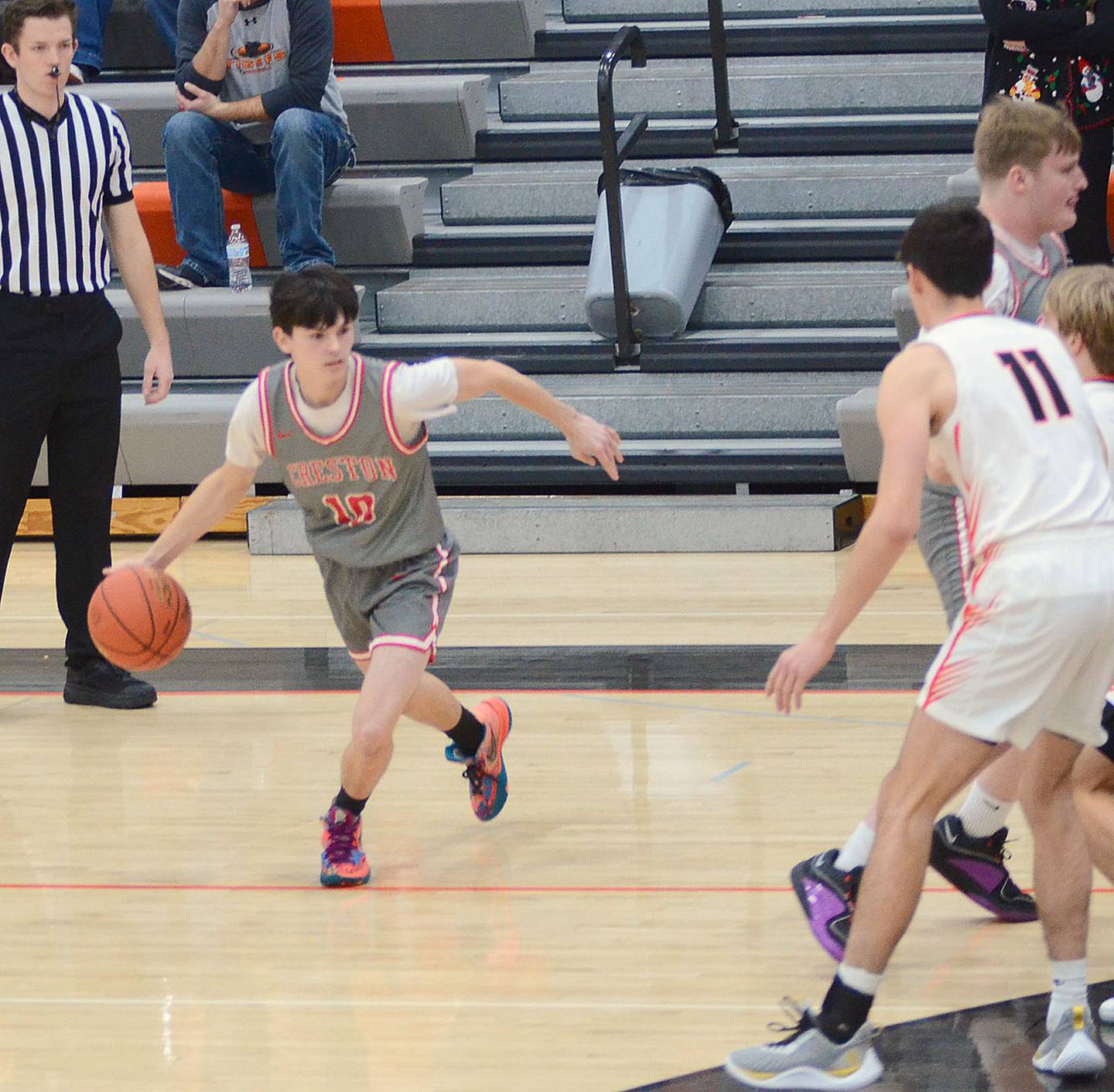 Creston's Gavin Millslagle dribbles off a screen by teammate Lucas Rushing during Monday's game in Grinnell. Millslagle scored two points and Rushing had six points in the 53-49 loss.