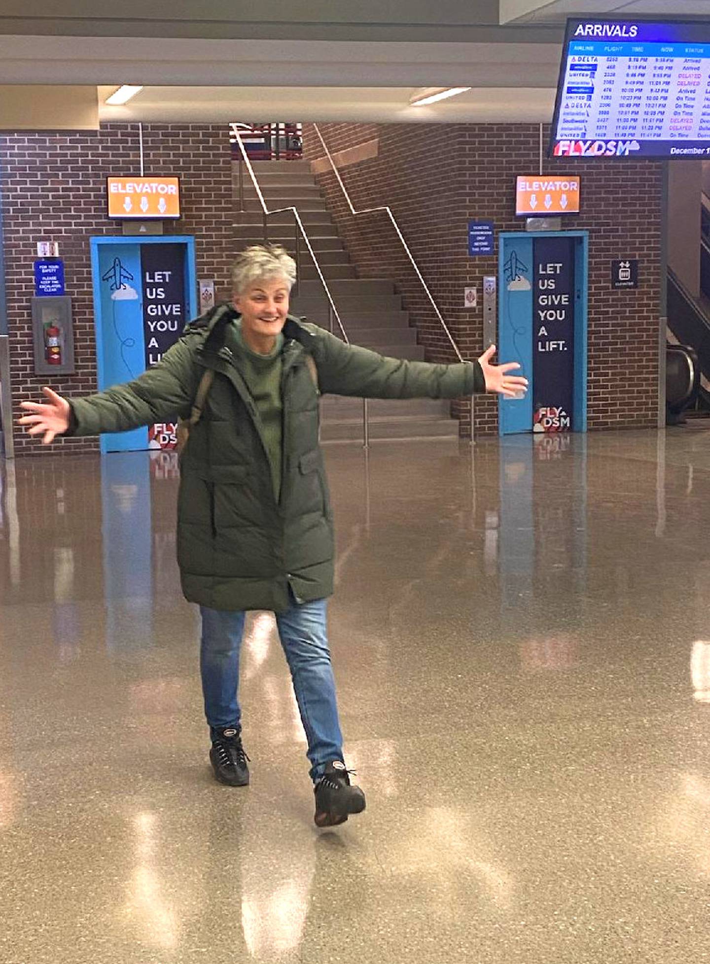 DeBruin greets her Iowa family at the Des Moines airport in December.