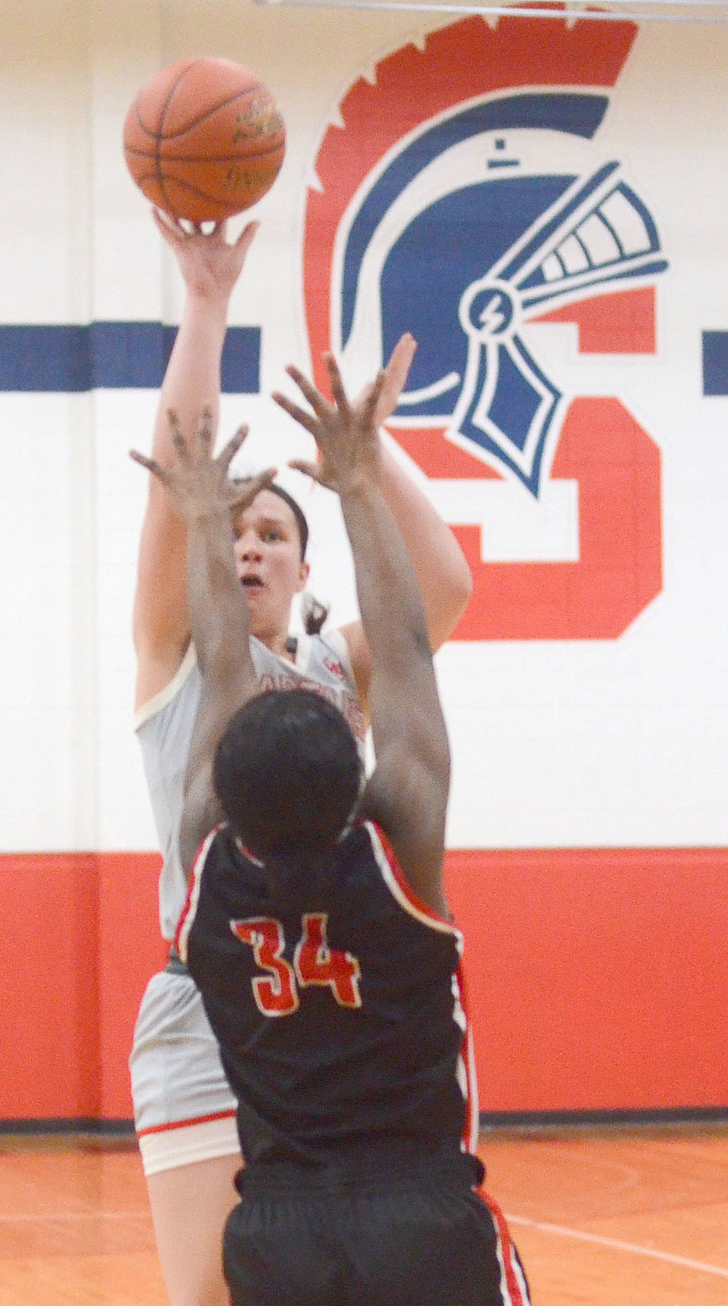 Sharmaine Tapling of Southwestern shoots over a Southeastern defender during Wednesday's home game. Tapling had six points in the 54-49 win.