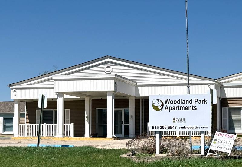 A "For Rent" sign is next to the Woodland Park Apartments sign at 326 Summerset Street. The building formerly housed Good Samaritan Society.