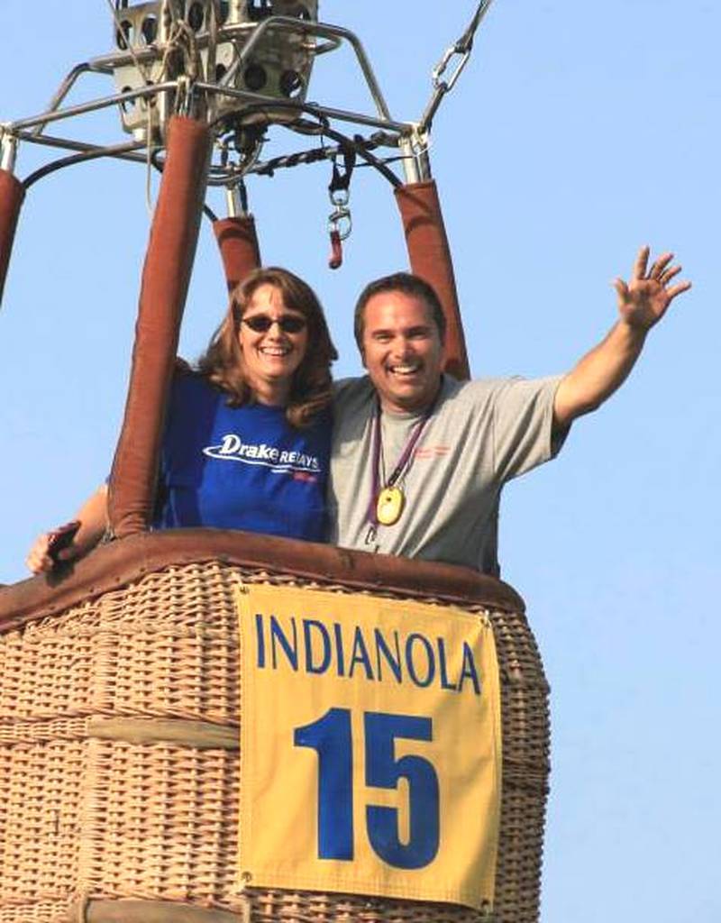 Pilot Dale Dommer celebrates hitting the target alongside his sister at a past National Balloon Classic in Indianola.