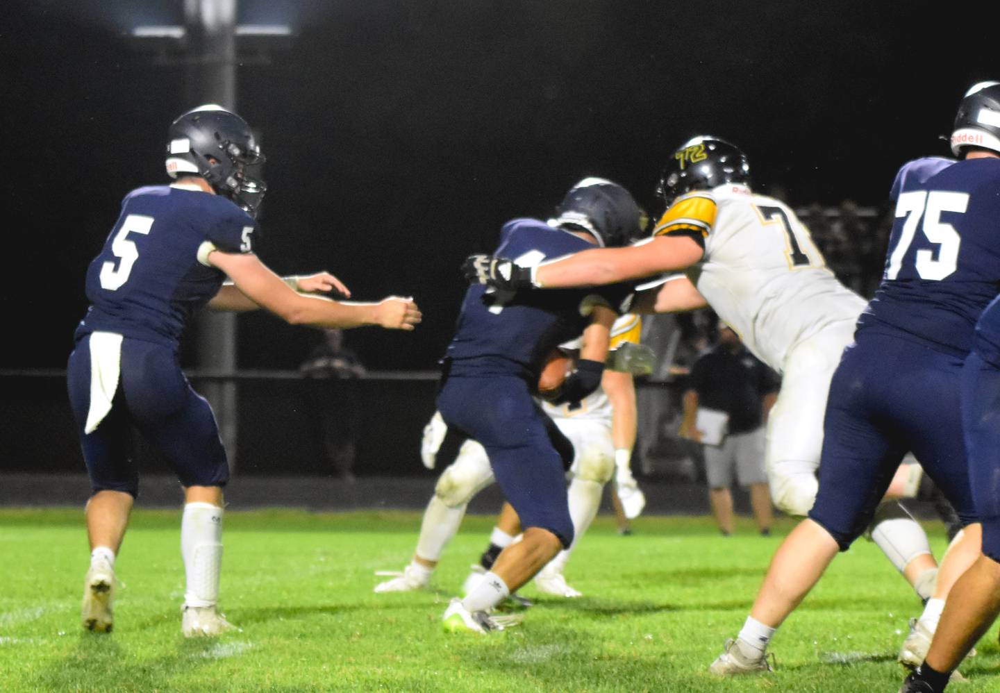 Jace Smith gets through the line to tackle Bedford running back Garrison Motsinger after he got the handoff from quarterback Conner Nally.