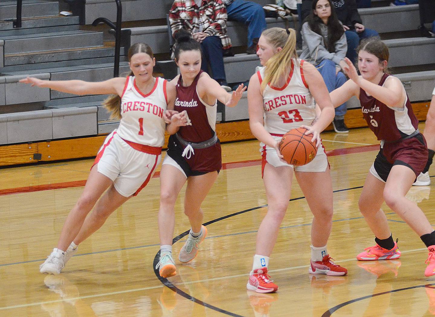 Creston's Kadley Bailey is guarded closely by Kylie Meier of Clarinda as she approaches a handoff from Brynn Tussey. Bailey led the Panthers with 21 points.