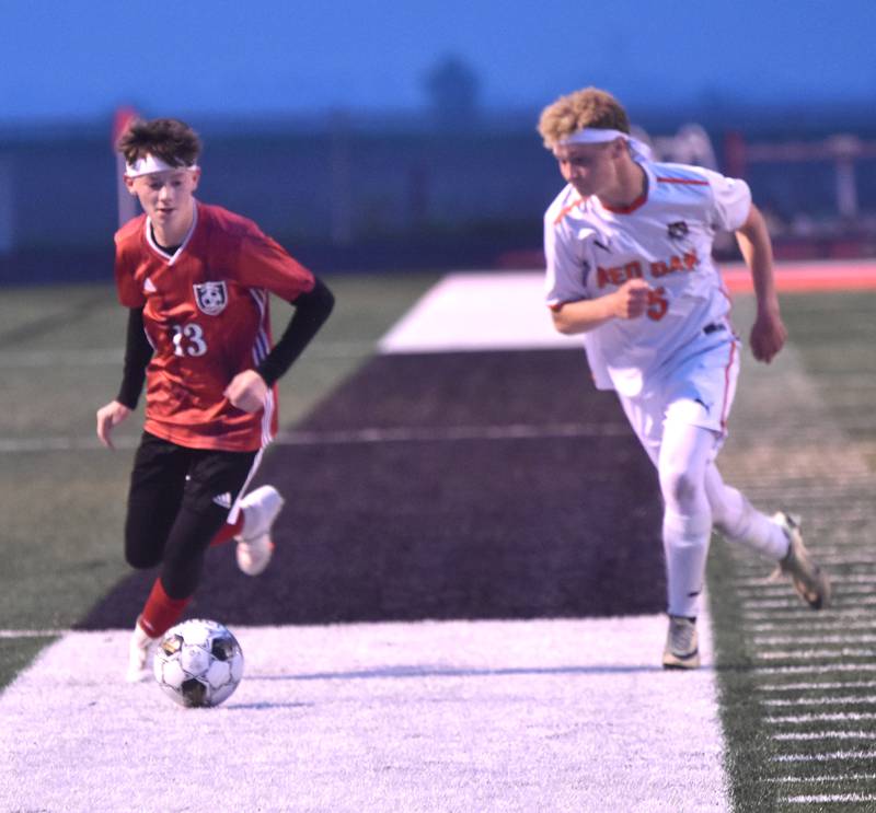 Junior Justin Loudon controls the ball down the sidelines.