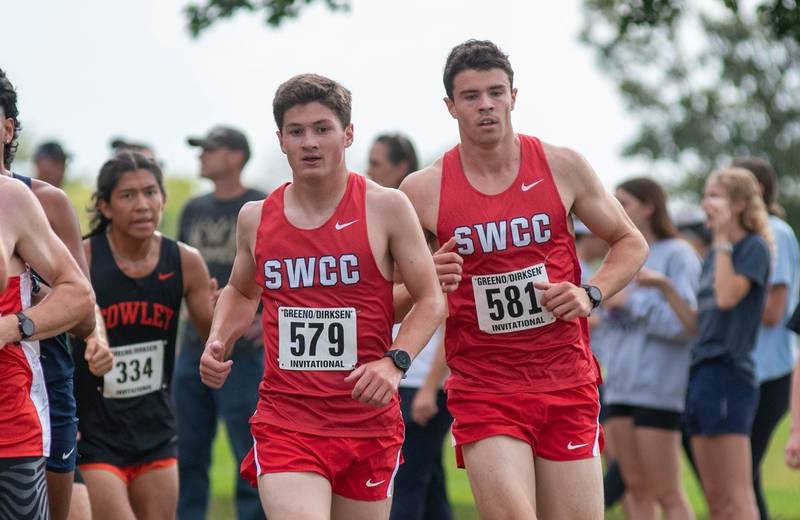 SWCC's Brandon Briley of Creston, left, and Zach Roome run together during the Greeno/Dirksen Invitational Saturday. Briley ran a 28:04, missing the national-qualifying time by four seconds.