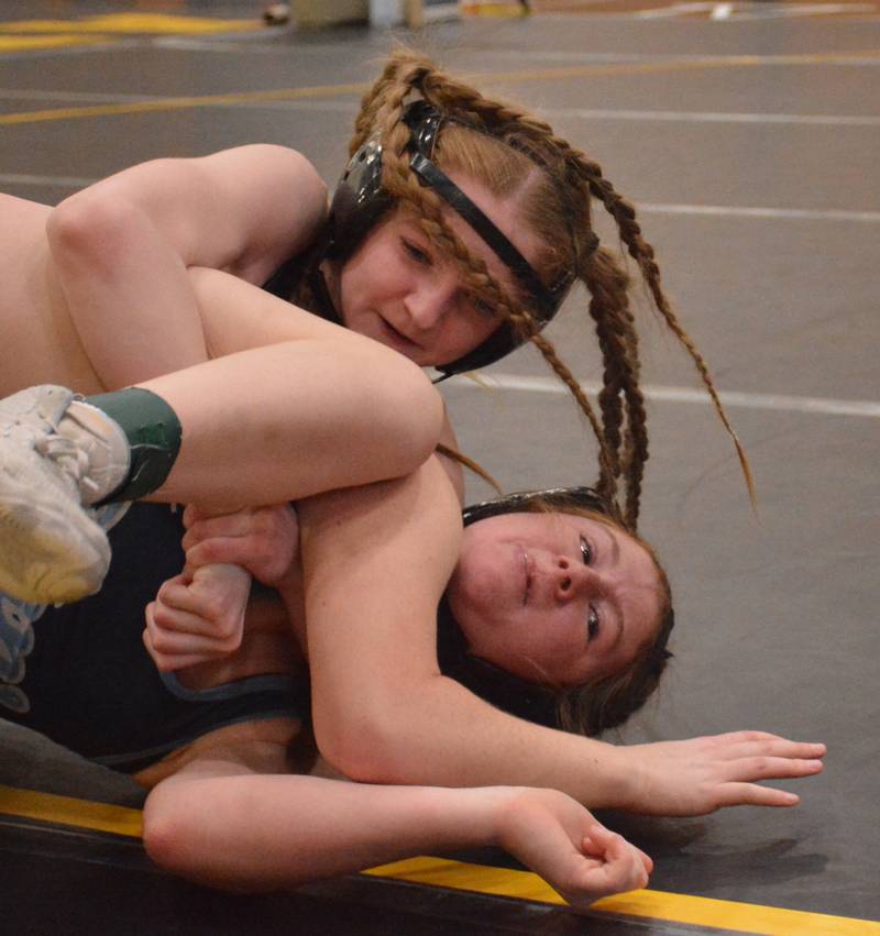 SWAT's Destiny Fry puts Lewis Central's Leighton Finnegan on her back during their match at 120 pounds in the Atlantic tournament Saturday.