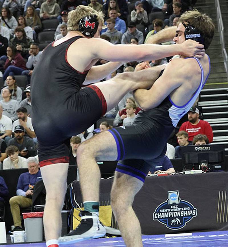 Jackson Kinsella of University of Nebraska-Kearney (right) works to complete a takedown against Jeremiah Larson of Maryville College during 197-pound action at the NCAA Division II national tournament. Kinsella won a 7-2 decision on his way to placing sixth and earning All-American status.