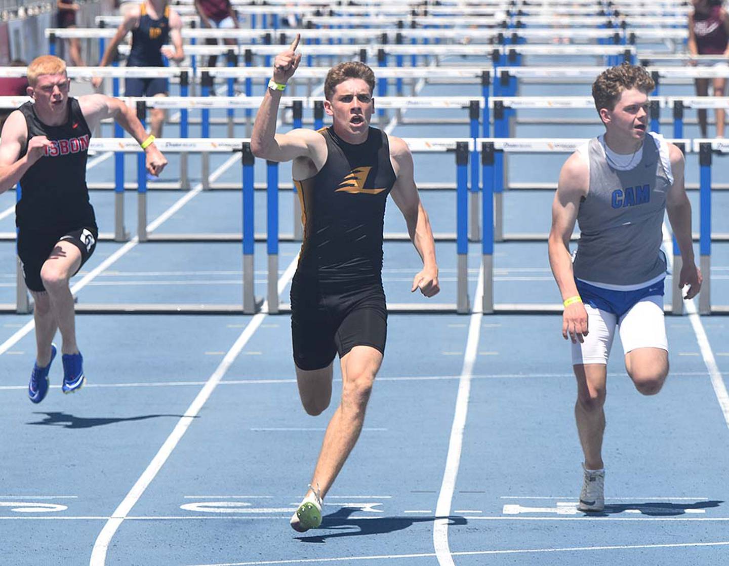 Gabe Funk celebrates the first of his two state championships in the 110 meter hurdles. Funk owns the school record of 14.2.