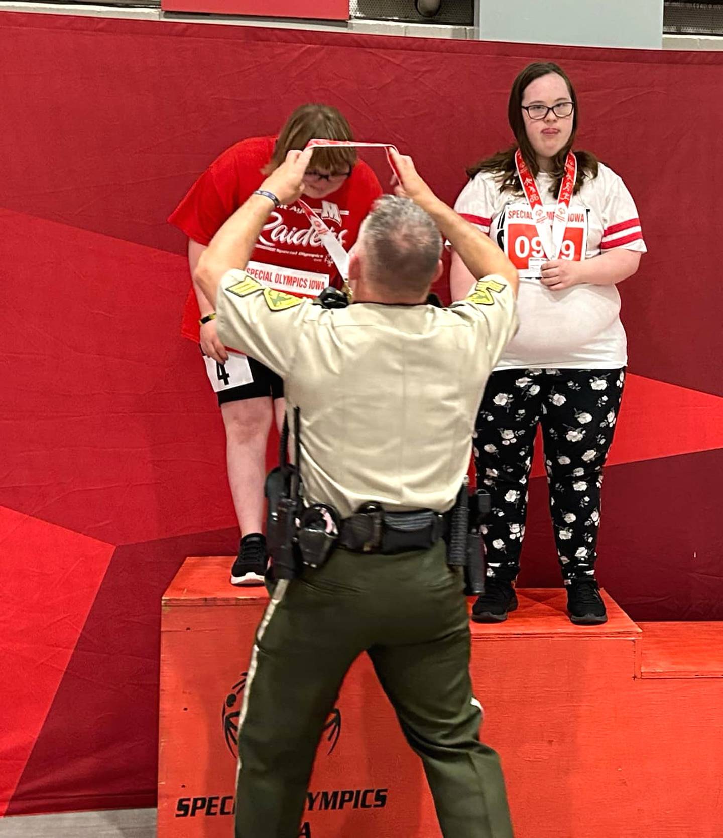 Tessa is awarded first place at the state Special Olympics championship.