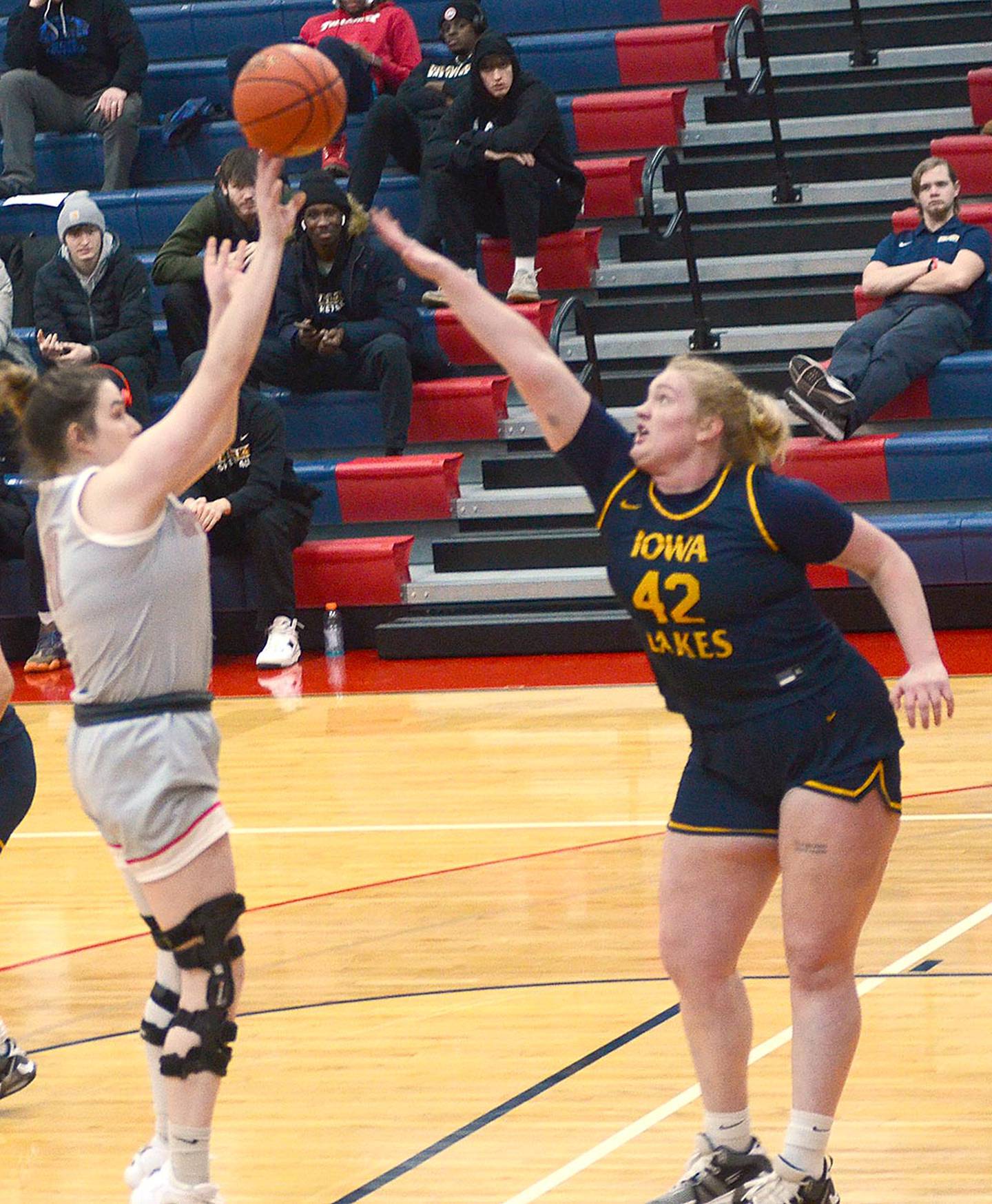Southwestern center Mikayla Hearon shoots against Emma Kanz of Iowa Lakes. Hearon scored five points. Kanz led the Lakers with 24 points.