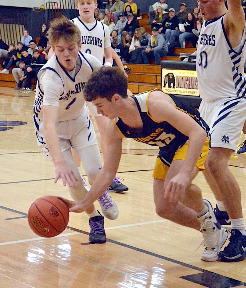 NV junior Ty Rardin (2) fights for a loose ball with Lenox's Ashton Leonard in a boys basketball game last Tuesday in Greenfield