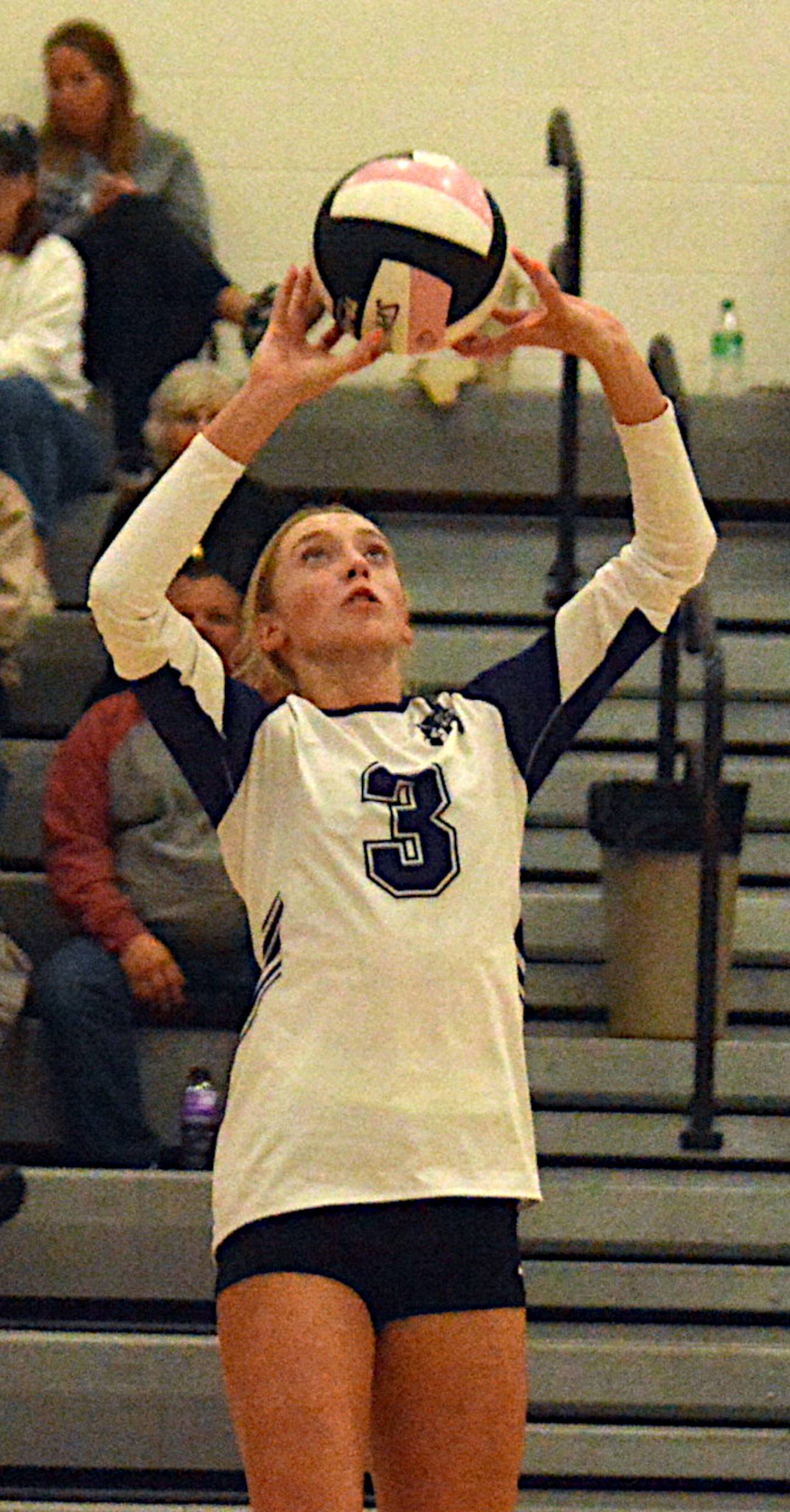 Nodaway Valley/OM senior Izzy Eisbach passes the ball to a teammate during regional volleyball action Monday night in Stuart.