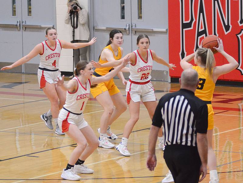 Paytn Harter, Atlantic's all-time scoring and rebounding leader with 1,281 points, is surrounded by Creston defenders Ella Turner (4), Kadley Bailey (1) and Ady Morrison (22) during Monday's game. Harter scored 21 points in Atlantic's 47-28 victory.