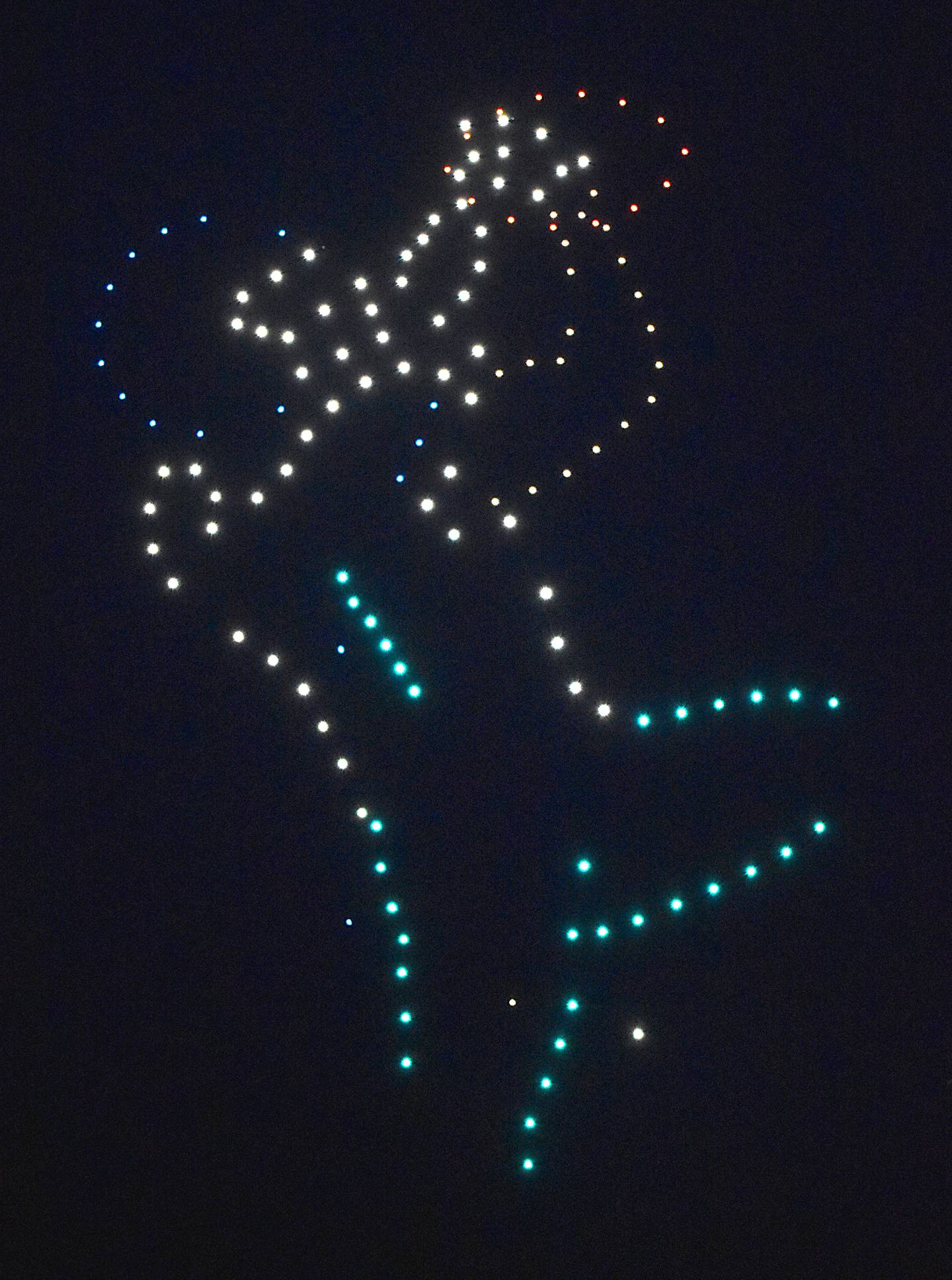 A football player, with East Union colors, makes a catch.