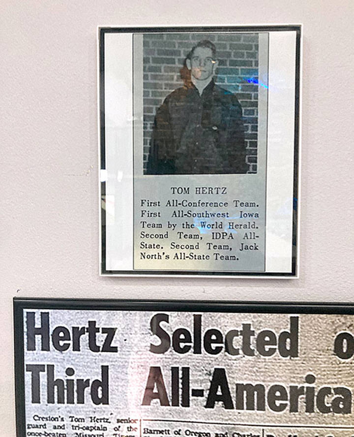 The display includes a special photo section for the late Tom Hertz, who became an All-American football player at the University of Missouri after an all-state career in Creston.