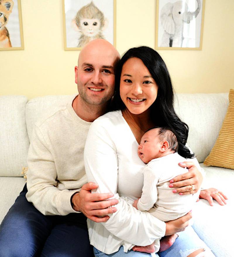 The family histories of Jeff and Jasmine Newland are a part of Iowa's past with immigration. They are pictured with son Liam.