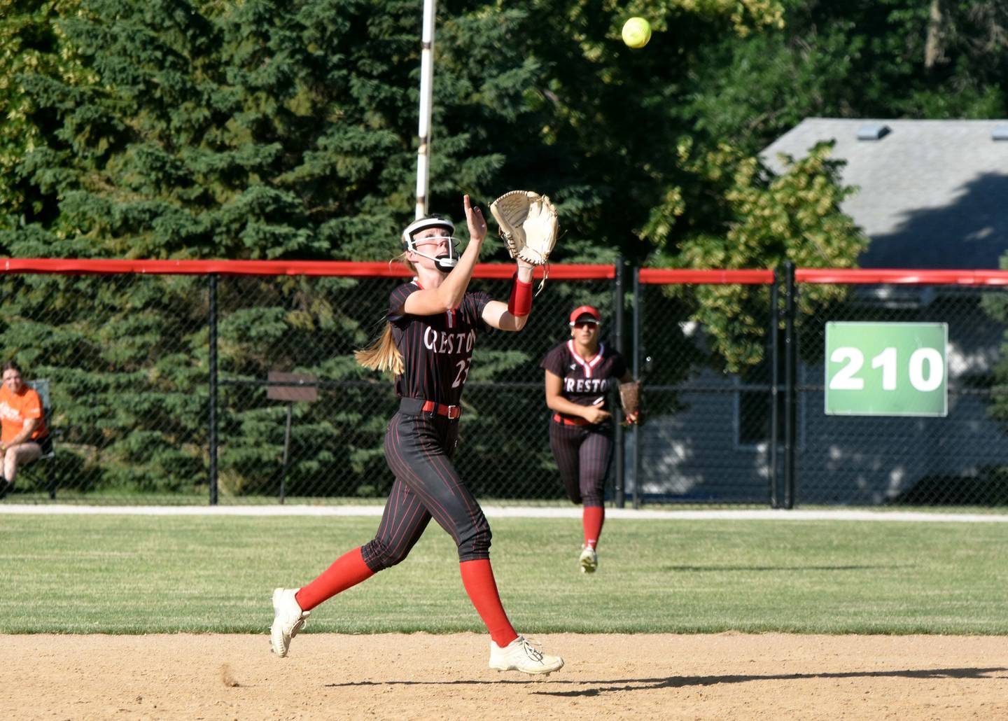 Shortstop Avery Staver catches a fly ball in game one.