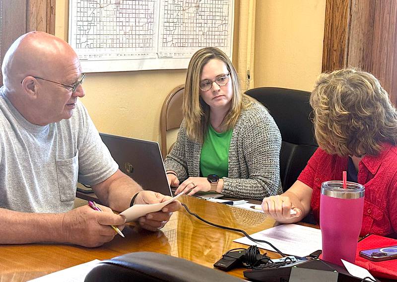 Adair County Auditor Mandy Berg (middle) with supervisors chairman Jerry Walker and supervisor Jodie Hoadley in a recent meeting.