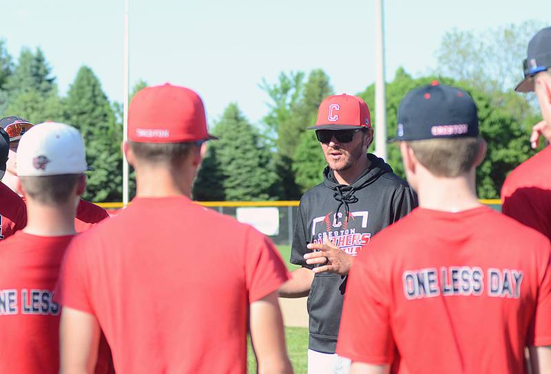 Creston baseball coach Brandon Phipps meets with players prior to Wednesday's practice. The Panthers open the 2026 season Monday at home against Carlisle.